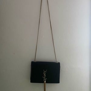 Black leather YSL, with some details that you can see in the pictures.